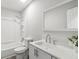 This bathroom features a single sink vanity, framed mirror, and tub with shower combination at 1354 Litchfield Ct, Snellville, GA 30078
