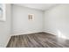 Bright room with gray wood-look floors and a window letting in natural light at 1354 Litchfield Ct, Snellville, GA 30078