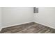 Bright bedroom with gray wood-look floors and neutral paint at 1354 Litchfield Ct, Snellville, GA 30078