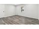 Cozy bedroom with gray walls, modern flooring, white door, and window at 1354 Litchfield Ct, Snellville, GA 30078