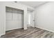 Cozy bedroom with closet, light walls, and wood-look floors at 1354 Litchfield Ct, Snellville, GA 30078