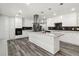Bright kitchen with white cabinets, granite counters, stainless appliances, and a kitchen island at 1354 Litchfield Ct, Snellville, GA 30078