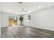 Open living room featuring wood floors, natural light, ceiling fan and access to the deck at 1354 Litchfield Ct, Snellville, GA 30078