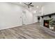 Spacious living room featuring hardwood floors, a cozy fireplace, and bright white walls and trim at 1354 Litchfield Ct, Snellville, GA 30078
