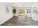 Bright and open living room featuring hardwood floors, backyard access, and ample natural light at 1354 Litchfield Ct, Snellville, GA 30078