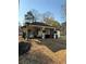 Relaxing back porch featuring ample seating and an outdoor dining area at 197 Buckhorn Dr, Temple, GA 30179