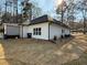 Exterior home view with freshly installed sod and landscaping plus black gutters and downspouts at 197 Buckhorn Dr, Temple, GA 30179