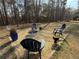 Backyard setting with Adirondack chairs and a fire pit at 197 Buckhorn Dr, Temple, GA 30179