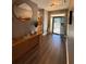 Welcoming foyer featuring wood floors, a stylish mirror, and access to a nearby bathroom at 197 Buckhorn Dr, Temple, GA 30179