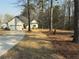Charming home with a two-car garage, mature trees, and a well-manicured lawn at 197 Buckhorn Dr, Temple, GA 30179