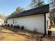 Exterior of a beautiful home featuring a freshly installed yard with landscaping and black rain gutters at 197 Buckhorn Dr, Temple, GA 30179