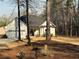 Attractive home featuring a well-manicured lawn, attached garage, and charming front porch with sitting bench at 197 Buckhorn Dr, Temple, GA 30179