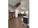 Open kitchen design with white cabinets, stainless appliances, and an adjacent mud room at 197 Buckhorn Dr, Temple, GA 30179