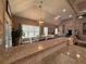 Open-concept kitchen featuring granite countertops and a view of the dining and living areas at 197 Buckhorn Dr, Temple, GA 30179