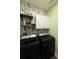 Bright laundry room with floral wallpaper and a modern washer and dryer set at 197 Buckhorn Dr, Temple, GA 30179
