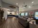 Spacious living room with wood floors, comfortable seating, and an open layout connecting to the kitchen at 197 Buckhorn Dr, Temple, GA 30179