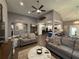 Open-concept living room featuring hardwood floors, modern decor, and seamless flow into the kitchen at 197 Buckhorn Dr, Temple, GA 30179
