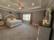 Spacious main bedroom features soft carpet, tray ceilings, and natural light at 197 Buckhorn Dr, Temple, GA 30179