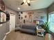 Charming home office with natural light, featuring a futon and collegiate decor at 197 Buckhorn Dr, Temple, GA 30179