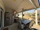 Covered patio with ample seating and an outdoor dining area at 197 Buckhorn Dr, Temple, GA 30179