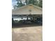 Pavilion with picnic tables for outdoor gatherings and lake views at 197 Buckhorn Dr, Temple, GA 30179