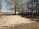 Backyard with sand volleyball court and lake views at 197 Buckhorn Dr, Temple, GA 30179