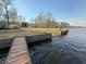 Waterfront property featuring a private dock on a serene lake at 197 Buckhorn Dr, Temple, GA 30179