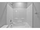 Bathroom featuring a white shower-tub combination with neutral wall and hardware at 2094 Callaway Nw Ct, Atlanta, GA 30318
