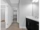 Bathroom featuring dark cabinets, a white quartz countertop, and views of the hallway and water closet at 2094 Callaway Nw Ct, Atlanta, GA 30318