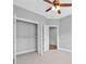This bedroom has a walk-in closet with a bright gray carpet and walls at 2094 Callaway Nw Ct, Atlanta, GA 30318