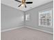 Neutral bedroom with plush carpet, ceiling fan and window letting in natural light at 2094 Callaway Nw Ct, Atlanta, GA 30318