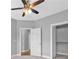 Bright, neutral bedroom featuring a ceiling fan, closet, and natural light at 2094 Callaway Nw Ct, Atlanta, GA 30318