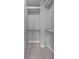 Walk-in closet with shelving and hanging rods at 2094 Callaway Nw Ct, Atlanta, GA 30318