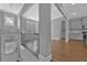 Inviting entryway with hardwood floors leading to a modern kitchen with stainless steel appliances at 2094 Callaway Nw Ct, Atlanta, GA 30318