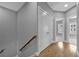 Upstairs hallway with neutral paint, wood floors, and doors to bedrooms at 2094 Callaway Nw Ct, Atlanta, GA 30318