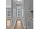 Hallway with hardwood floors, leads to other rooms with natural light at 2094 Callaway Nw Ct, Atlanta, GA 30318