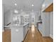 Bright kitchen features pendant lights, island with seating, and stainless steel appliances at 2094 Callaway Nw Ct, Atlanta, GA 30318