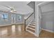 Open-concept living room with great natural light, ceiling fan, and staircase at 2094 Callaway Nw Ct, Atlanta, GA 30318