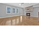 Spacious living room boasts a stone fireplace, hardwood floors and plenty of natural light at 2094 Callaway Nw Ct, Atlanta, GA 30318