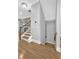 Elegant staircase with hardwood steps and wrought iron railing leads to upper and lower levels at 2094 Callaway Nw Ct, Atlanta, GA 30318