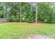 Spacious backyard with mature trees and lush greenery providing a serene outdoor space at 332 Cheryl Ct, Jonesboro, GA 30238