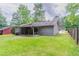 The backyard has a covered patio and a fence, offering space and privacy at 332 Cheryl Ct, Jonesboro, GA 30238