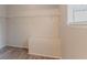 Walk-in closet with wire shelving, bench, and neutral tones, providing ample storage at 332 Cheryl Ct, Jonesboro, GA 30238