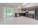 Bright kitchen featuring updated appliances, ample countertop space, and sliding glass doors to the backyard at 332 Cheryl Ct, Jonesboro, GA 30238