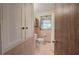 Bathroom with built-in storage, toilet, and shower/tub combo with a curtained window at 1122 Byers Sw Dr, Marietta, GA 30060