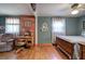Spacious bedroom featuring hardwood floors, a desk, sitting area and natural light at 1122 Byers Sw Dr, Marietta, GA 30060