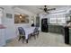 A kitchen featuring green cabinets, stainless steel appliances, and a kitchen dining area at 1122 Byers Sw Dr, Marietta, GA 30060