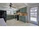 A kitchen featuring green cabinets, stainless steel appliances, and an outdoor view at 1122 Byers Sw Dr, Marietta, GA 30060
