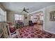 Cozy living room featuring hardwood floors, ceiling fan, and bright windows for natural light at 1122 Byers Sw Dr, Marietta, GA 30060