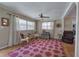 Bright and airy living room featuring a hardwood floor and an area rug at 1122 Byers Sw Dr, Marietta, GA 30060